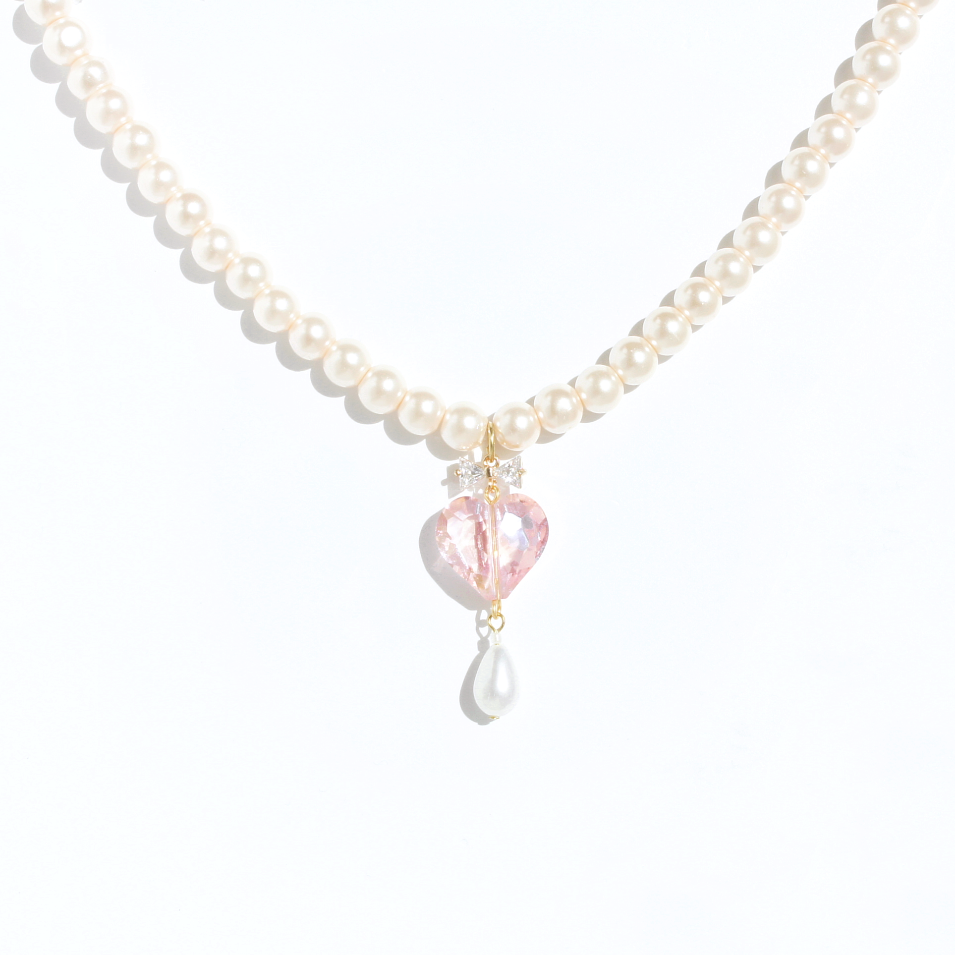 Whisper of Heart Pink Faux Pearl Necklace with Crystal Bow and Faceted Heart Pendant